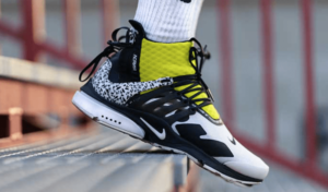 chaussure de running noir blanc et jaune avec design zéro drop