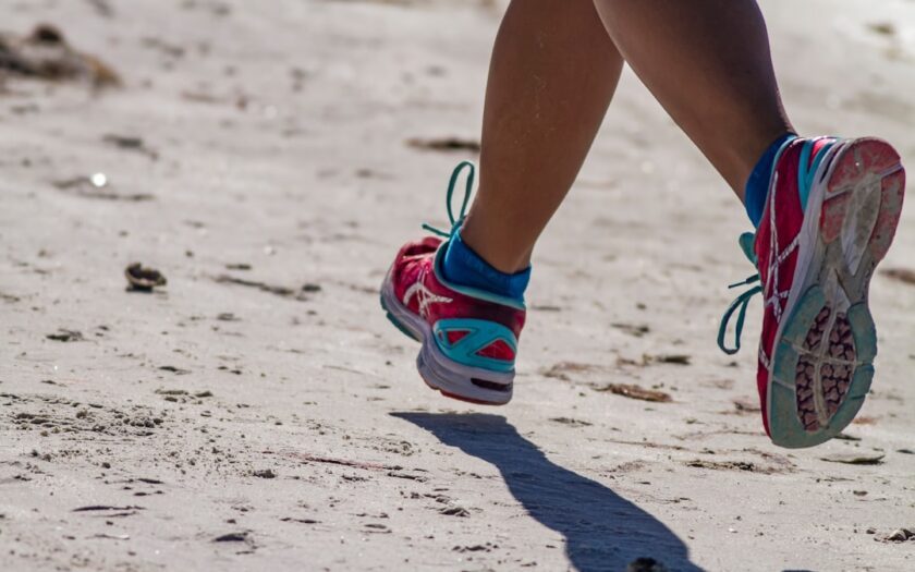 person wearing blue and white sneakers