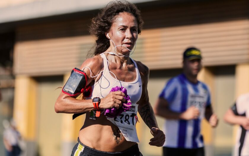 woman running with stereo headphones