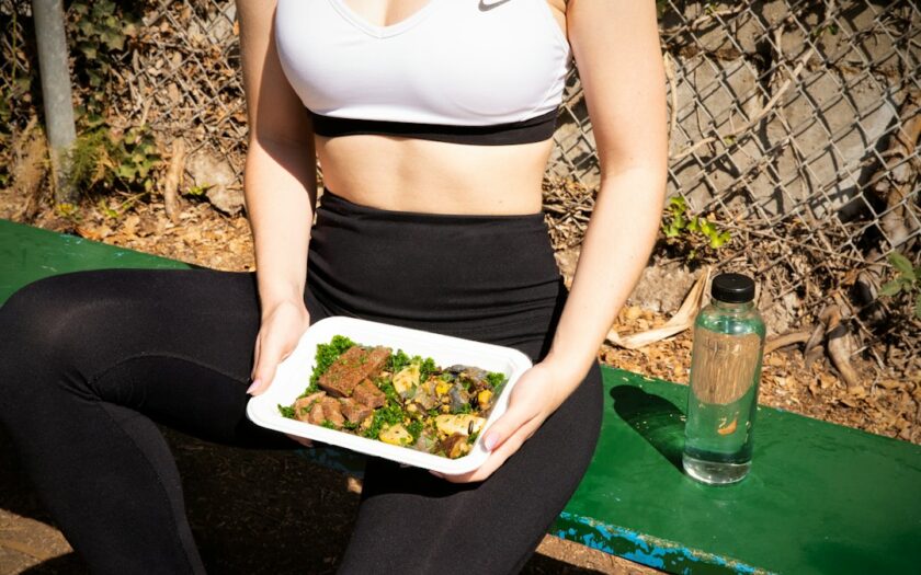 woman wearing white and black Nike sports bra